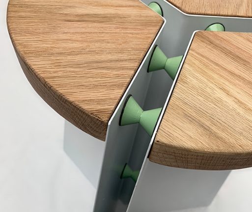 Three oak segments set into the base with green spacers