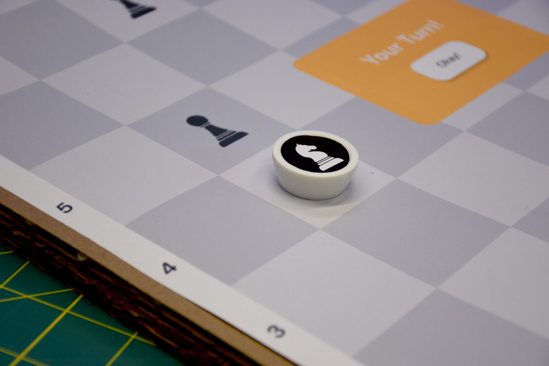 Prototype knight piece on the printed chess board
