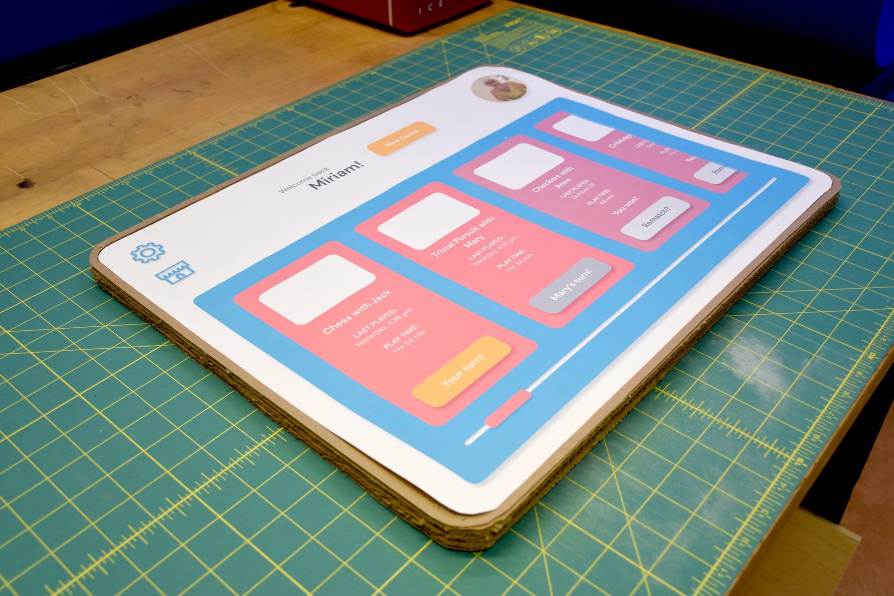 Printed home screen interface mounted on a cardboard board