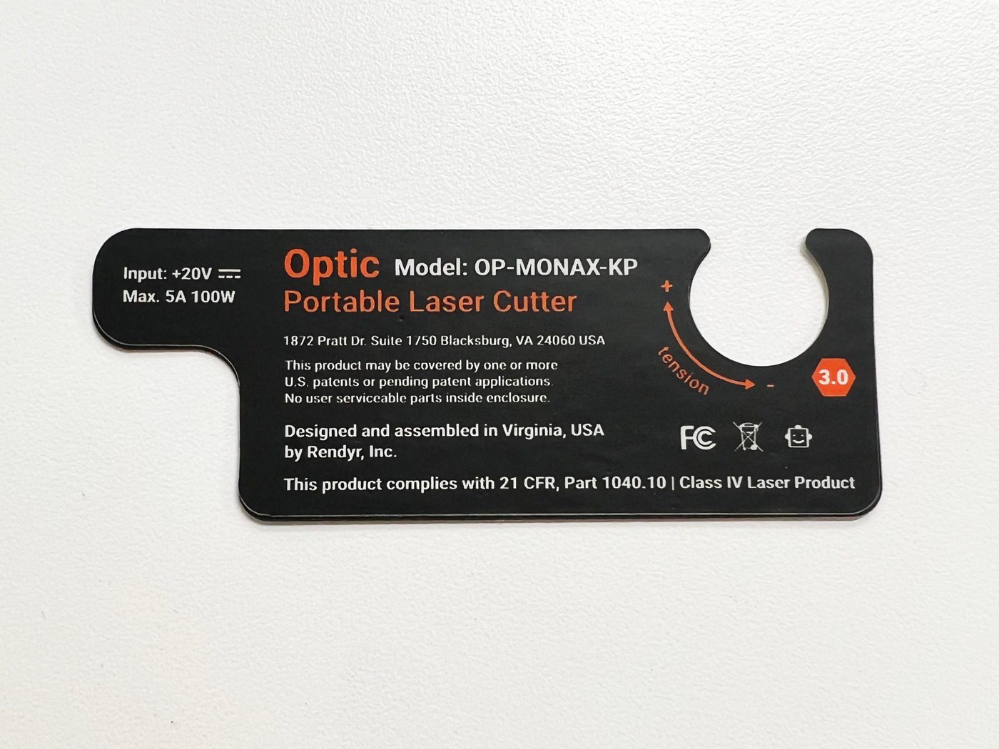 Optic rating label redesign with tension guide